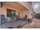 Covered patio with seating and access to the backyard at 1642 E Cardinal Dr, Casa Grande, AZ 85122