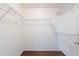 Spacious walk-in closet with shelving and wood-look floors for optimal storage solutions at 1642 E Cardinal Dr, Casa Grande, AZ 85122