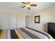 Comfortable bedroom featuring a ceiling fan, closet, and carpeted floors at 17010 E Calle Del Oro -- # D, Fountain Hills, AZ 85268