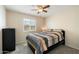 Bright bedroom with ceiling fan, closet and natural light from the window at 17010 E Calle Del Oro -- # D, Fountain Hills, AZ 85268
