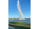 Scenic community fountain creates a rainbow over a tranquil lake, with a park and walking path nearby at 17010 E Calle Del Oro -- # D, Fountain Hills, AZ 85268