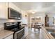 Modern kitchen with stainless steel appliances, countertops, and a dining area at 17010 E Calle Del Oro -- # D, Fountain Hills, AZ 85268
