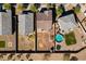 This aerial view showcases a home with a backyard featuring a pool, fire pit, and landscaped surroundings at 17043 N Avelino Dr, Maricopa, AZ 85138