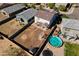 Aerial view of the backyard with a pool, fire pit, and covered patio at 17043 N Avelino Dr, Maricopa, AZ 85138
