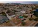 Gorgeous aerial view of a neighborhood at sunset, highlighting community amenities at 17043 N Avelino Dr, Maricopa, AZ 85138