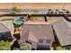 The aerial view of this house and neighborhood shows its proximity to farmland at 17043 N Avelino Dr, Maricopa, AZ 85138