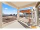 Charming back patio with pergola, stone base, and ample space for outdoor gatherings and enjoyment at 17043 N Avelino Dr, Maricopa, AZ 85138