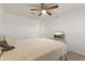 Relaxing bedroom featuring a neutral palette, ceiling fan, and a queen sized bed at 17043 N Avelino Dr, Maricopa, AZ 85138