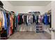 Walk-in closet showcasing ample storage with rods and shelves, perfect for organizing clothing and accessories at 17043 N Avelino Dr, Maricopa, AZ 85138