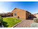 This backyard features a lush lawn and beautiful gravel landscaping at 1739 E Elegante Dr, Casa Grande, AZ 85122