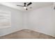 Bedroom with a ceiling fan, window with shutters, and carpeted floors at 1739 E Elegante Dr, Casa Grande, AZ 85122