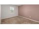 Bedroom with carpet, a neutral color scheme and a large window at 1739 E Elegante Dr, Casa Grande, AZ 85122