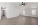 Comfortable room with neutral carpet flooring, light walls, view of bathroom and a ceiling fan at 1739 E Elegante Dr, Casa Grande, AZ 85122