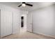 Bedroom with a ceiling fan, closet with sliding doors, and an open doorway at 1739 E Elegante Dr, Casa Grande, AZ 85122