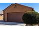 Exterior of garage featuring desert landscaping and a paved driveway at 1739 E Elegante Dr, Casa Grande, AZ 85122