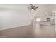 Open-concept living space with tile floors and a view into the kitchen, perfect for entertaining at 1739 E Elegante Dr, Casa Grande, AZ 85122
