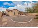 An exterior shot shows a backyard with desert landscaping, a paved patio, and covered seating at 1775 E Sycamore Rd, Casa Grande, AZ 85122