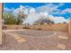 Large backyard with gravel, pavers, desert landscaping, and a seating area at 1775 E Sycamore Rd, Casa Grande, AZ 85122