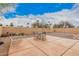 Backyard showcasing a desert landscape, paved patio, and an outdoor dining area at 1775 E Sycamore Rd, Casa Grande, AZ 85122