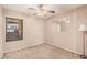 Cozy bedroom with carpet flooring, ceiling fan, and window at 1775 E Sycamore Rd, Casa Grande, AZ 85122