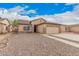 Charming single-story home featuring a two-car garage and low-maintenance desert landscaping at 1775 E Sycamore Rd, Casa Grande, AZ 85122
