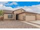 Charming single-story home featuring a two-car garage and low-maintenance desert landscaping at 1775 E Sycamore Rd, Casa Grande, AZ 85122