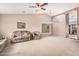 Spacious living room with vaulted ceiling, neutral carpet, and large window at 1775 E Sycamore Rd, Casa Grande, AZ 85122