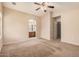 Large main bedroom with walk-in closet, neutral paint, plush carpet, and access to en suite bathroom at 1775 E Sycamore Rd, Casa Grande, AZ 85122