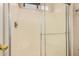 Bright bathroom shower with glass door and white tile surround at 1775 E Sycamore Rd, Casa Grande, AZ 85122