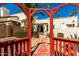 Charming backyard featuring a red gazebo, desert landscaping, and a pathway leading to the home's entrance at 1839 E Vinedo Ln, Tempe, AZ 85284