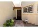 Charming front entryway with stone walkway, garden beds, and decorative door at 1839 E Vinedo Ln, Tempe, AZ 85284