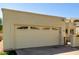 Two-car garage with decorative windows and a well-manicured lawn at 1839 E Vinedo Ln, Tempe, AZ 85284