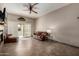 Cozy living room with tile flooring, comfortable seating, and natural light from the sliding glass door at 1839 E Vinedo Ln, Tempe, AZ 85284