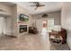 Comfortable living room with tiled floors, fireplace, and access to outdoor patio at 1839 E Vinedo Ln, Tempe, AZ 85284