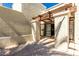 Charming patio area with a wood pergola, stone columns, and a decorative paved floor, perfect for outdoor relaxation at 1839 E Vinedo Ln, Tempe, AZ 85284