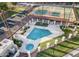 Aerial view of a community pool area with lounge chairs and a hot tub, offering a resort-like experience at 1839 E Vinedo Ln, Tempe, AZ 85284