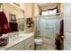 Bright bathroom with marble vanity, shower, and toilet at 19722 N Regents Park Dr, Surprise, AZ 85387