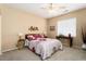 Cozy bedroom with neutral walls, carpeted floors, and tasteful decor creating a tranquil atmosphere at 19722 N Regents Park Dr, Surprise, AZ 85387