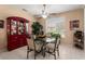 Inviting dining area with a glass table, modern chairs, and a decorative china cabinet at 19722 N Regents Park Dr, Surprise, AZ 85387