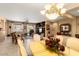 Open-concept living and dining area filled with natural light, perfect for gatherings and entertaining guests at 19722 N Regents Park Dr, Surprise, AZ 85387
