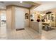 Neutral toned entryway that flows into the dining room area with easy access to other rooms at 19722 N Regents Park Dr, Surprise, AZ 85387