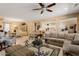 Bright, open-concept living room with tile floors, seamless transitions, and an airy, inviting atmosphere at 19722 N Regents Park Dr, Surprise, AZ 85387