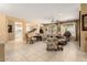 Spacious living room with neutral colored walls, tile floors, and plenty of room for entertaining at 19722 N Regents Park Dr, Surprise, AZ 85387