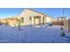 Charming backyard featuring low-maintenance gravel landscaping, small trees, and a covered patio space perfect for relaxing outdoors at 20162 W Buchanan St, Buckeye, AZ 85326