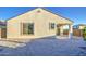 Backyard showcasing a desert landscape, covered patio, and a low-maintenance design at 20162 W Buchanan St, Buckeye, AZ 85326