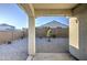 Backyard patio view with desert landscaping and block fence for privacy at 20162 W Buchanan St, Buckeye, AZ 85326
