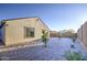 An inviting backyard featuring rock landscaping, young trees, and a serene, private space perfect for outdoor enjoyment at 20162 W Buchanan St, Buckeye, AZ 85326