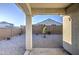 Backyard view looking at gravel, block wall and house at 20162 W Buchanan St, Buckeye, AZ 85326