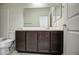 Bathroom vanity with a sink, toilet, shower-tub combination, and a large mirror at 20162 W Buchanan St, Buckeye, AZ 85326
