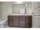 Bathroom features a dark vanity and a toilet with a tub at 20162 W Buchanan St, Buckeye, AZ 85326